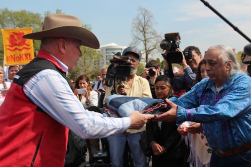 Communities exchanging items in moments of respect and healing