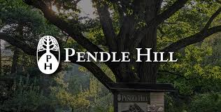 Pendle Hill logo with scenic campus tree in background