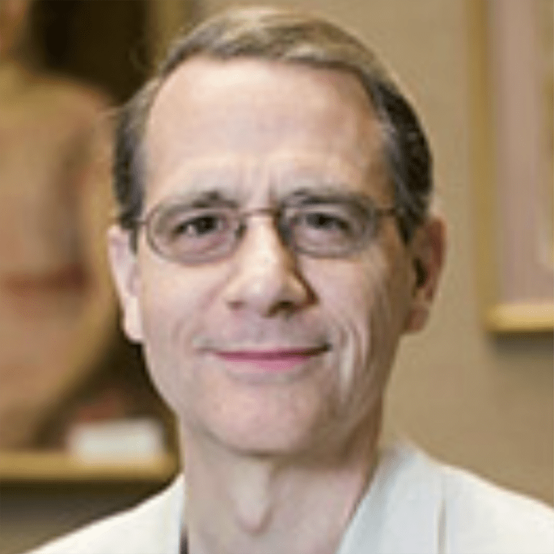 Colleen Wessel-McCoy smiling in front of a tree