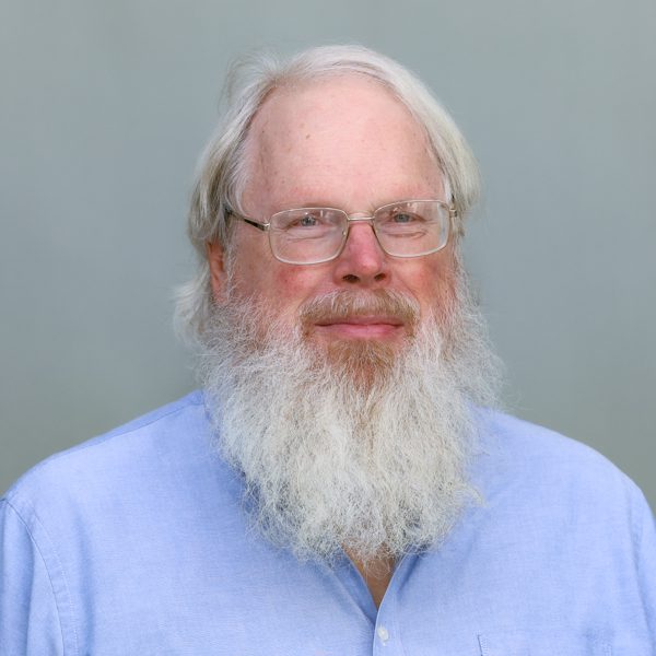 Colleen Wessel-McCoy smiling in front of a tree